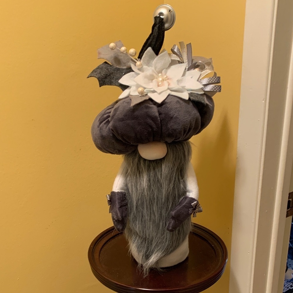 Whimsical Christmas Gnome Decor with Pumpkin Hat and poinsettia flower